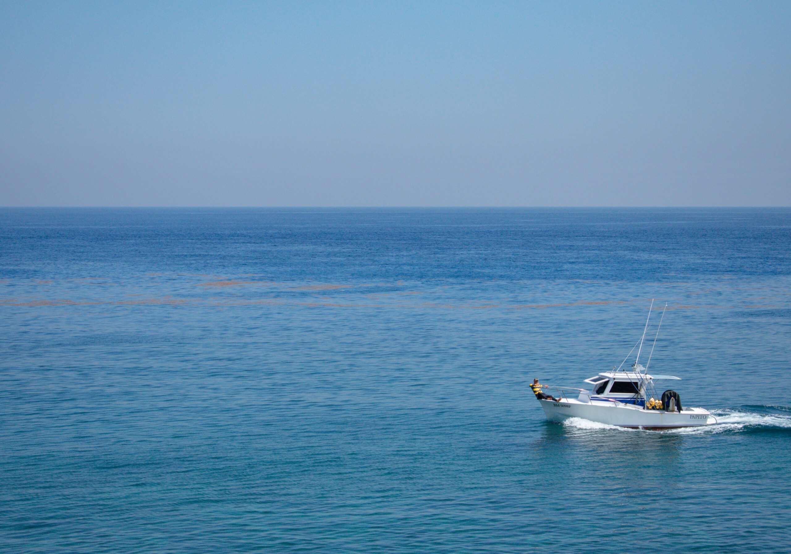 Aerial view of a private yacht on the Aegean Sea near Santorini