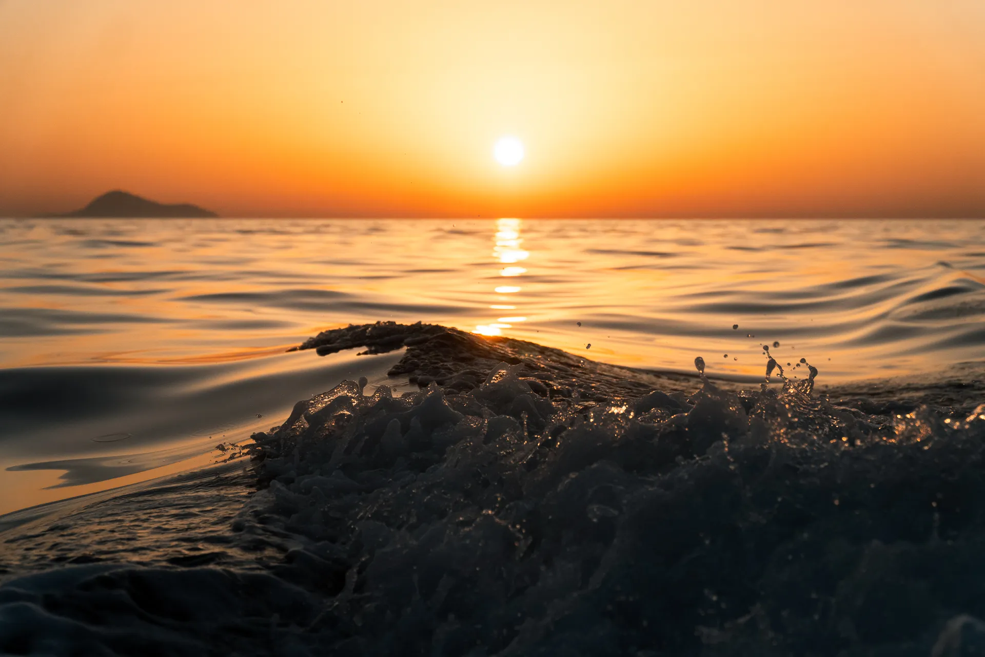 Santorini sunset seen from a Black Swan private yacht on the caldera